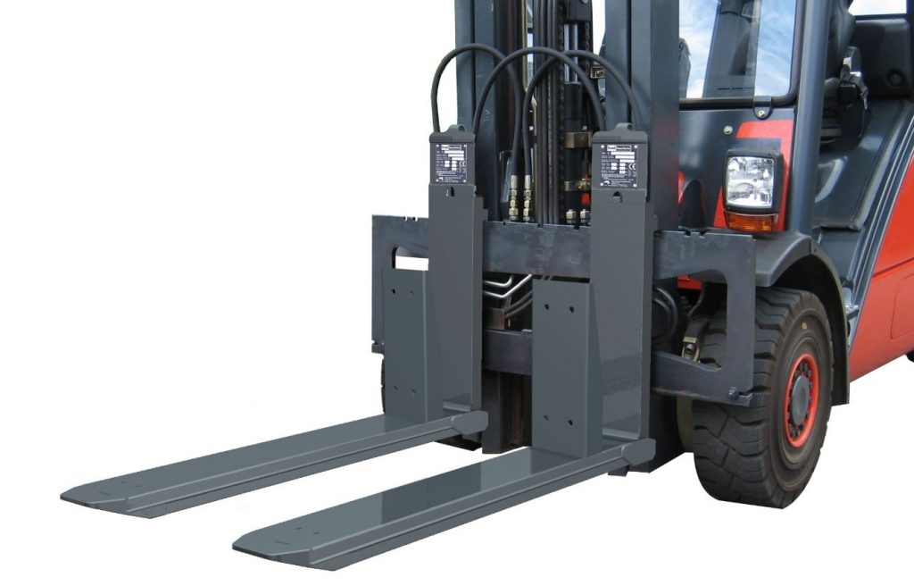 A close-up of a forklift's forks and lifting mechanism.