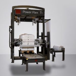 Automatic pallet wrapping machine securing stacked bags.